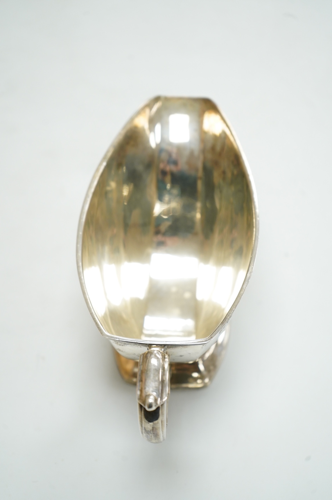 A George VI silver sauceboat by Mappin & Webb, Sheffield, 1938, with engraved initial, length 20cm, 6.9oz.